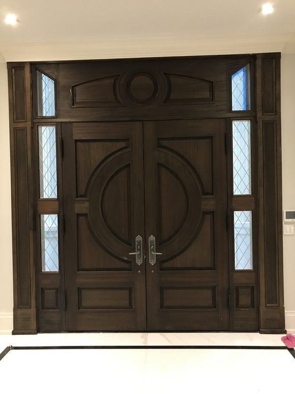Classic single wood door with glass on corners