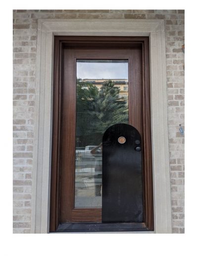 Modern Medium Brown Wood Exterior Door and decorative black panel